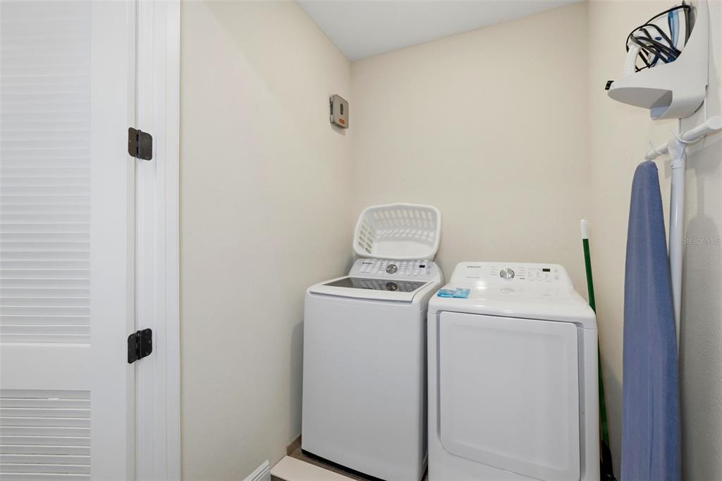 8098 Knee Deep Road Kissimmee, FL 34747 - Photo 31 of 40 a utility room with dryer and washer