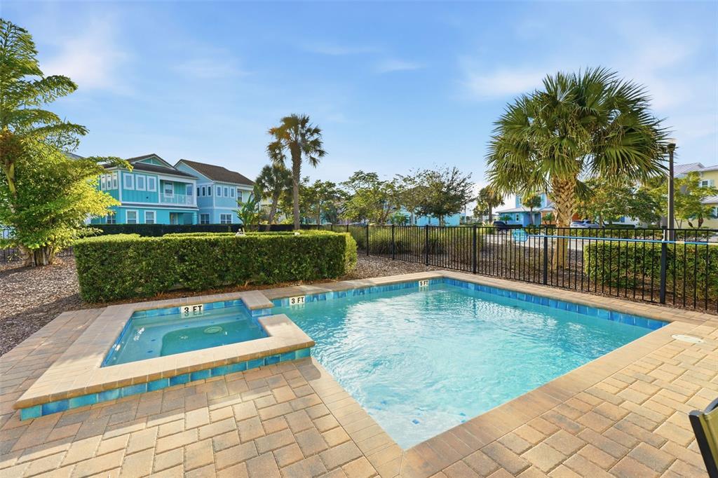 8098 Knee Deep Road Kissimmee, FL 34747 - Photo 34 of 40 a view of a swimming pool with a patio
