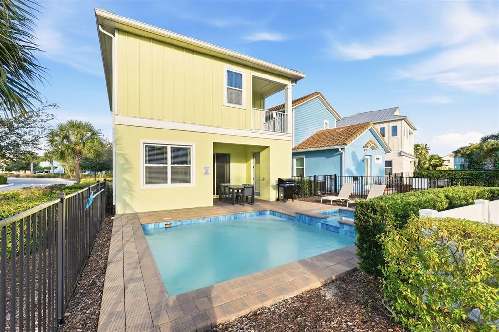 8098 Knee Deep Road Kissimmee, FL 34747 - Photo 36 of 40 a view of house with swimming pool and sitting area
