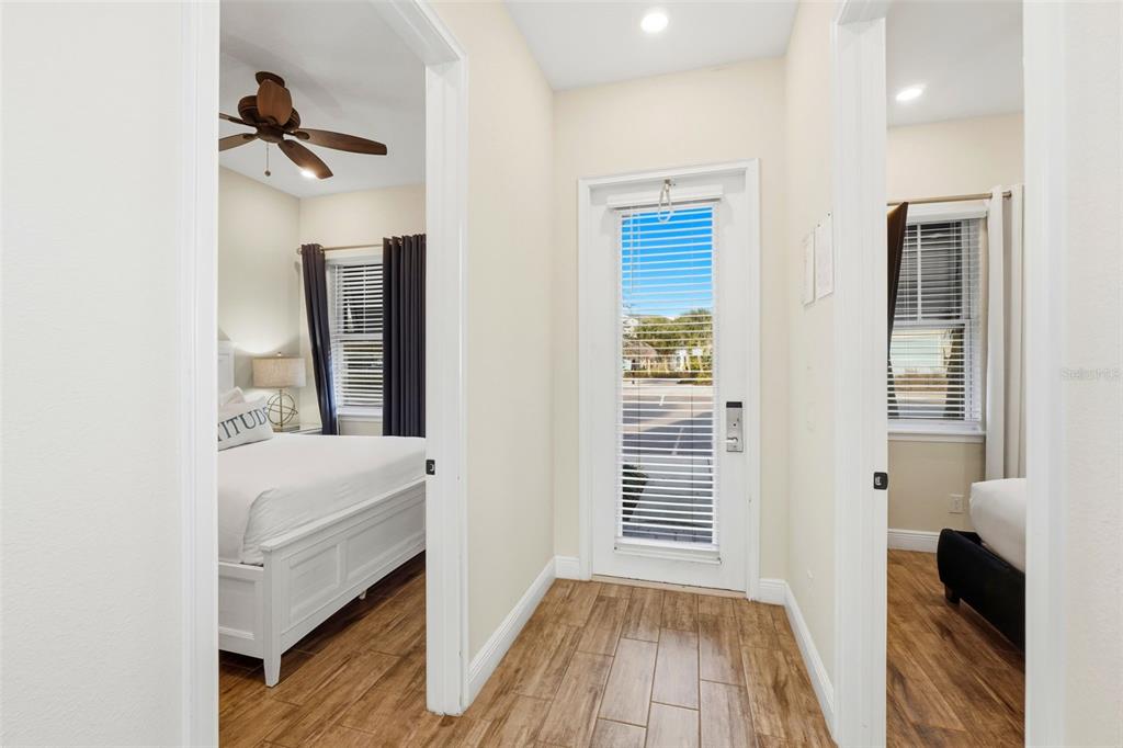 8098 Knee Deep Road Kissimmee, FL 34747 - Photo 5 of 40 a view of a bedroom with a bed and wooden floor