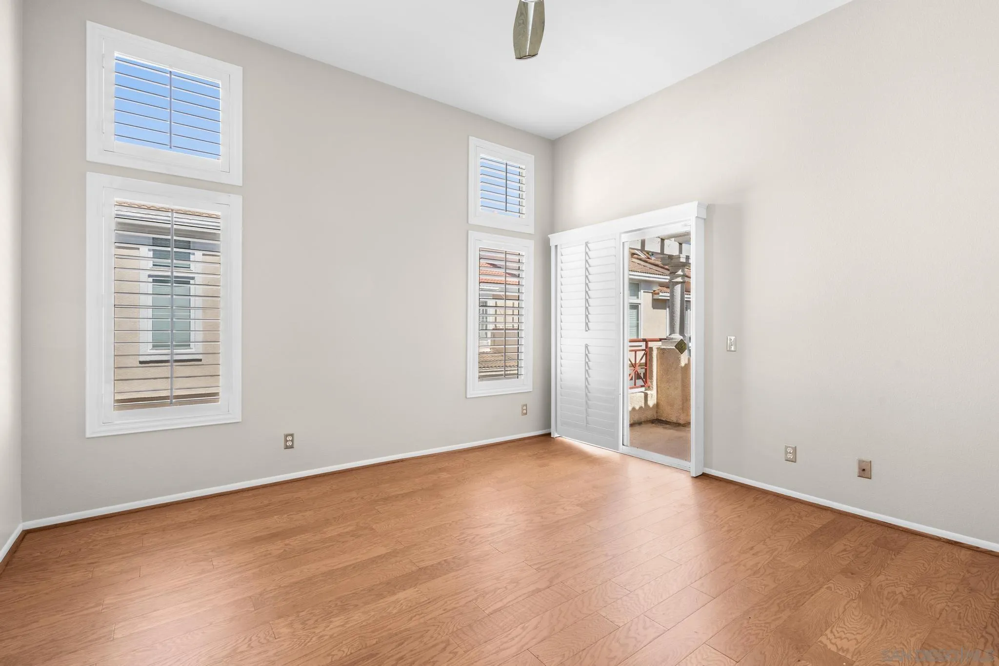 9338 Babauta Road, Unit 78 San Diego, CA 92129 - Photo 12 of 26 an empty room with windows