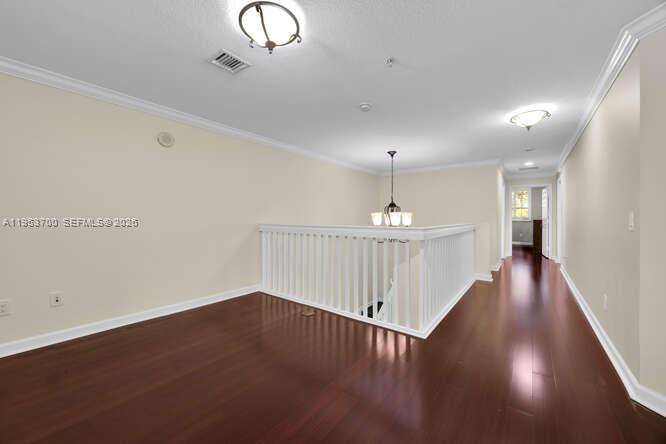8395 Southwest 73rd Avenue, Unit 104 Miami, FL 33143 - Photo 12 of 35 a view of a hallway with wooden floor