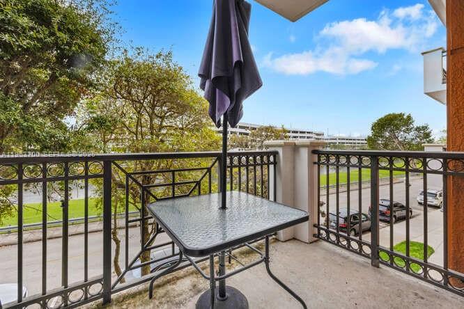 8395 Southwest 73rd Avenue, Unit 104 Miami, FL 33143 - Photo 19 of 35 a view of a balcony with furniture