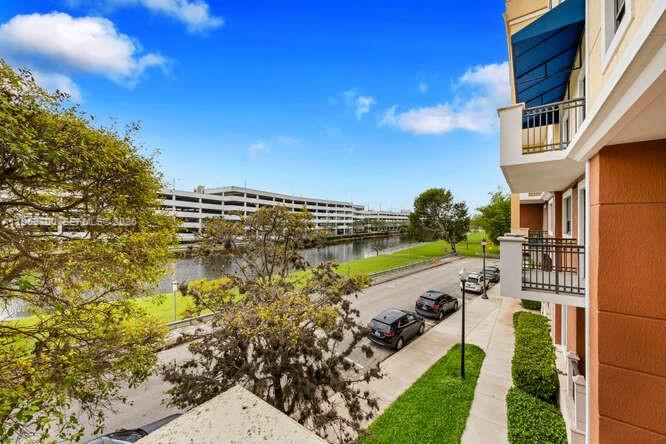8395 Southwest 73rd Avenue, Unit 104 Miami, FL 33143 - Photo 20 of 35 a view of a city with lawn chairs