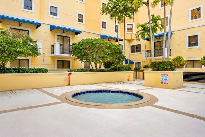 8395 Southwest 73rd Avenue, Unit 104 Miami, FL 33143 - Photo 23 of 35 a view of a white house with swimming pool