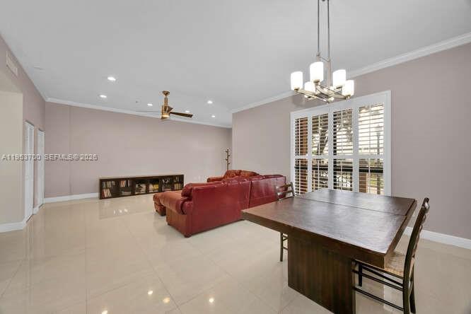 8395 Southwest 73rd Avenue, Unit 104 Miami, FL 33143 - Photo 6 of 35 a living room with furniture and a chandelier