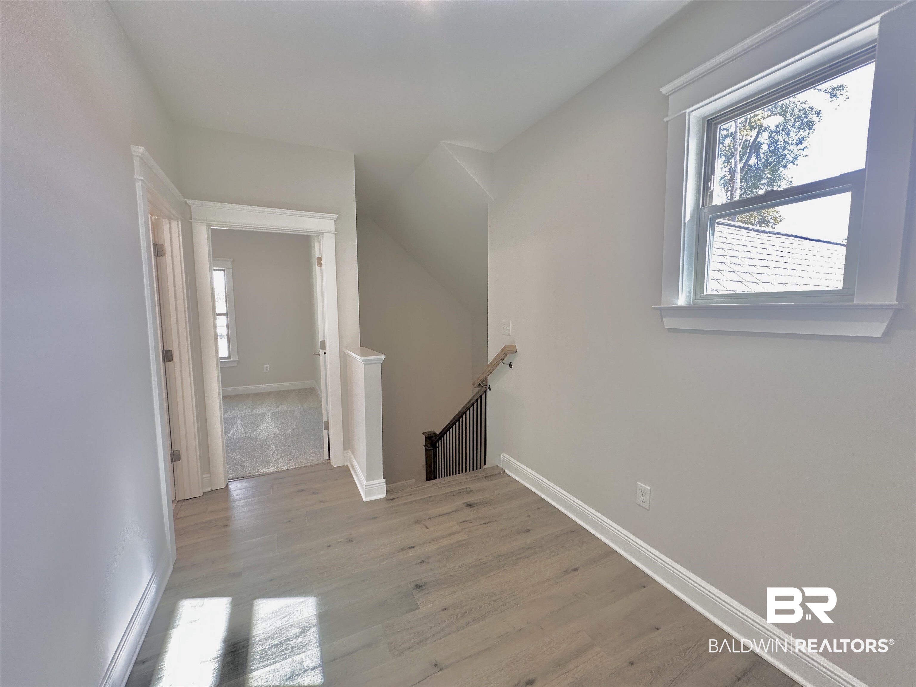 691 Kitfox Avenue Fairhope, AL 36532 - Photo 19 of 42 Interior space featuring plenty of natural light and light hardwood / wood-style flooring