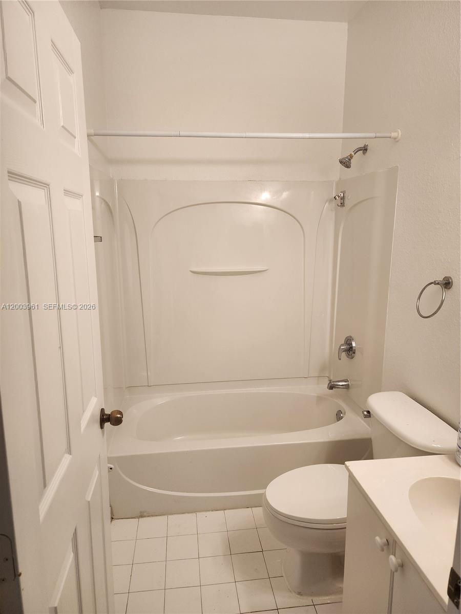 6972 Northwest 179th Street, Unit 2034 Hialeah, FL 33015 - Photo 5 of 10 a bathroom with a toilet and a shower