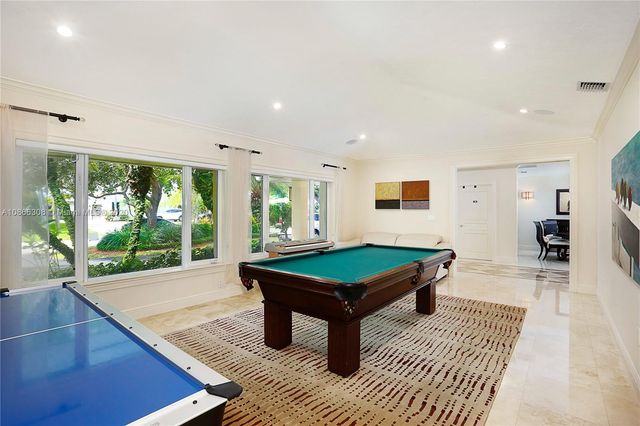 a view of house with swimming pool outdoor seating