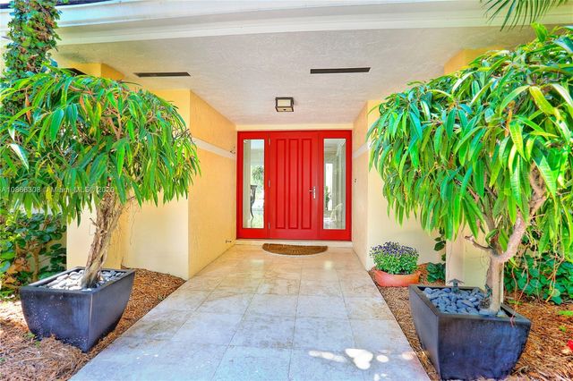 a view of park with large trees