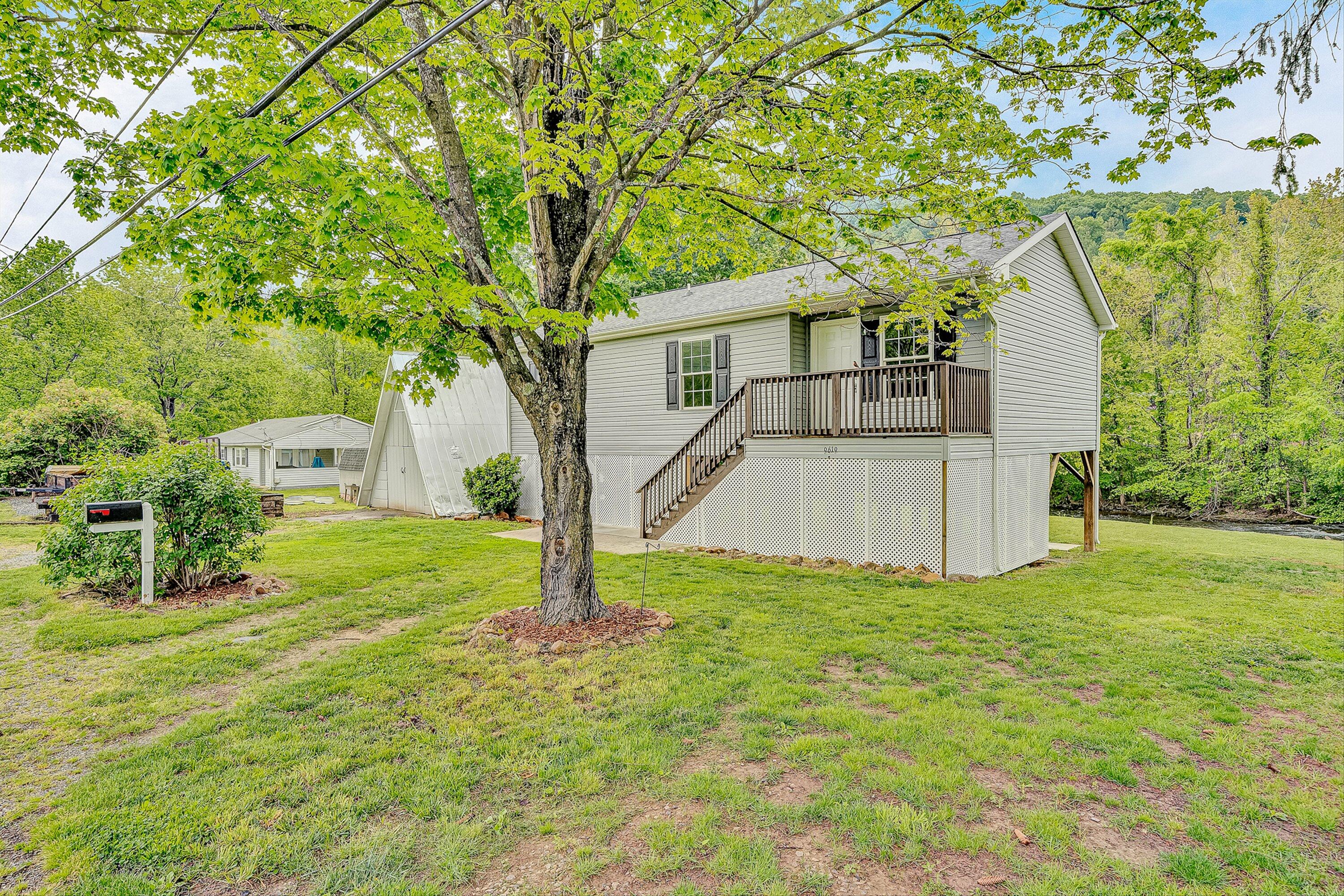 9619 Old Roanoke Road Elliston, VA 24087 - Photo 1 of 29 a view of a house with backyard