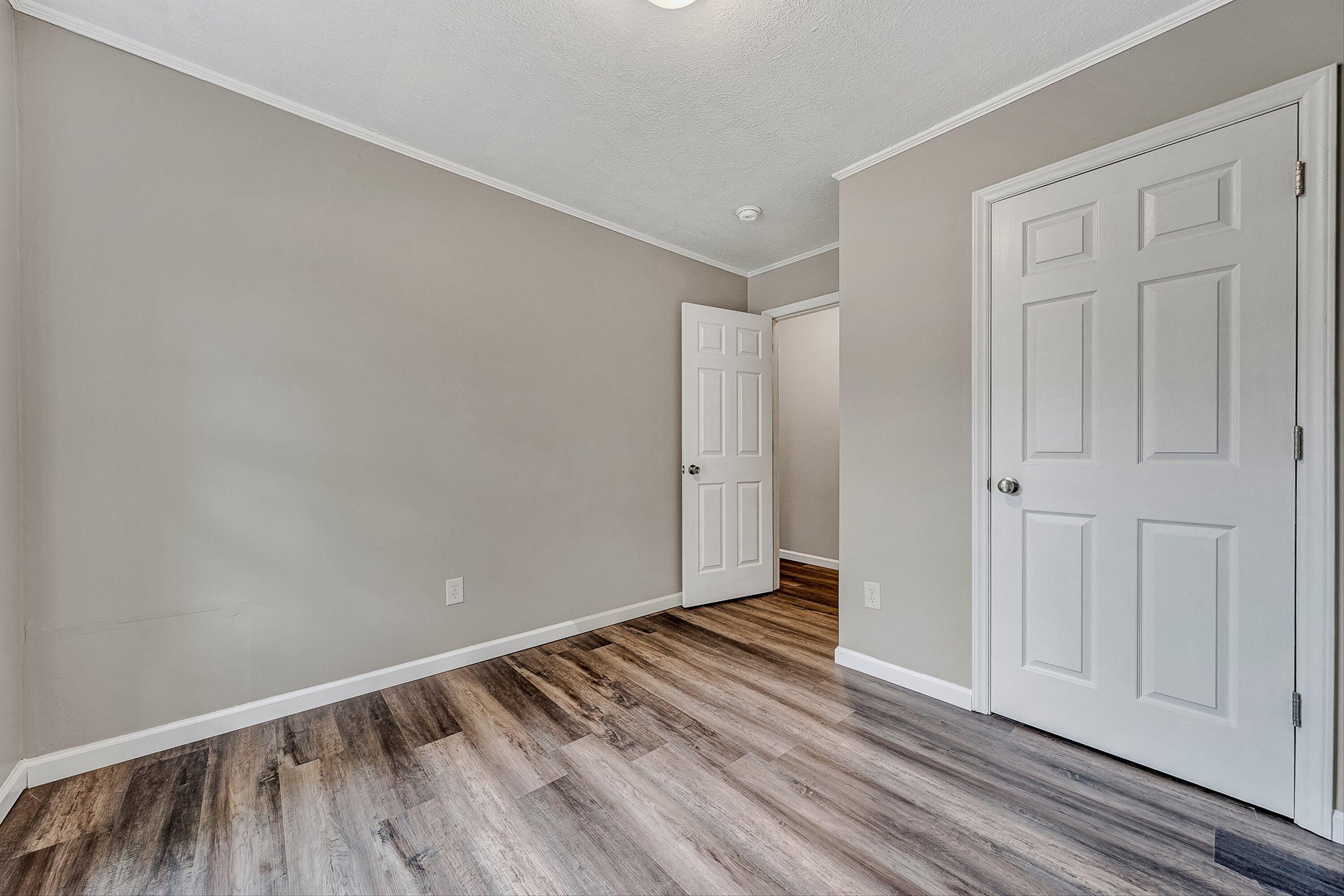 9619 Old Roanoke Road Elliston, VA 24087 - Photo 11 of 29 a view of an empty room with wooden floor