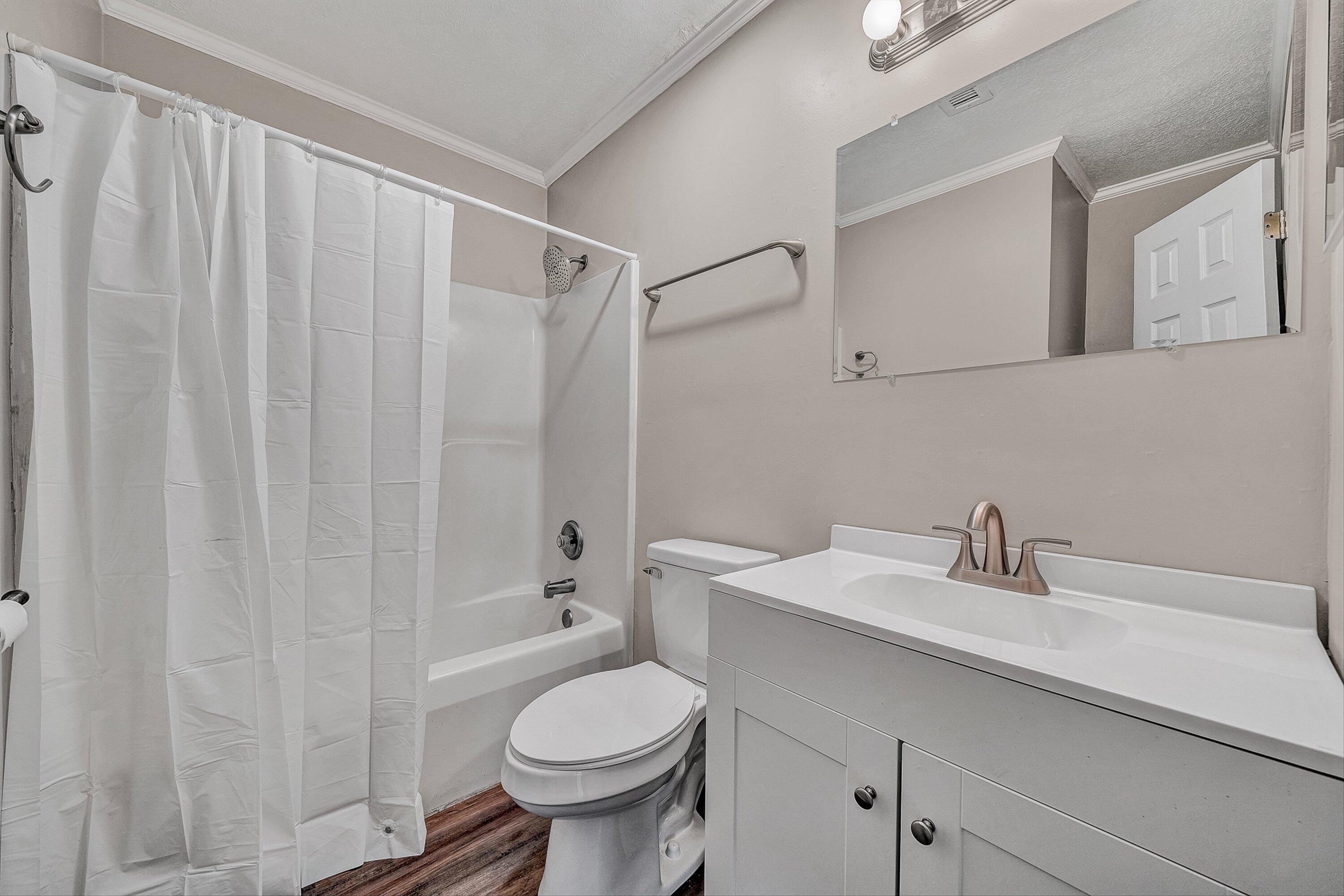 9619 Old Roanoke Road Elliston, VA 24087 - Photo 13 of 29 a bathroom with a sink a toilet and shower