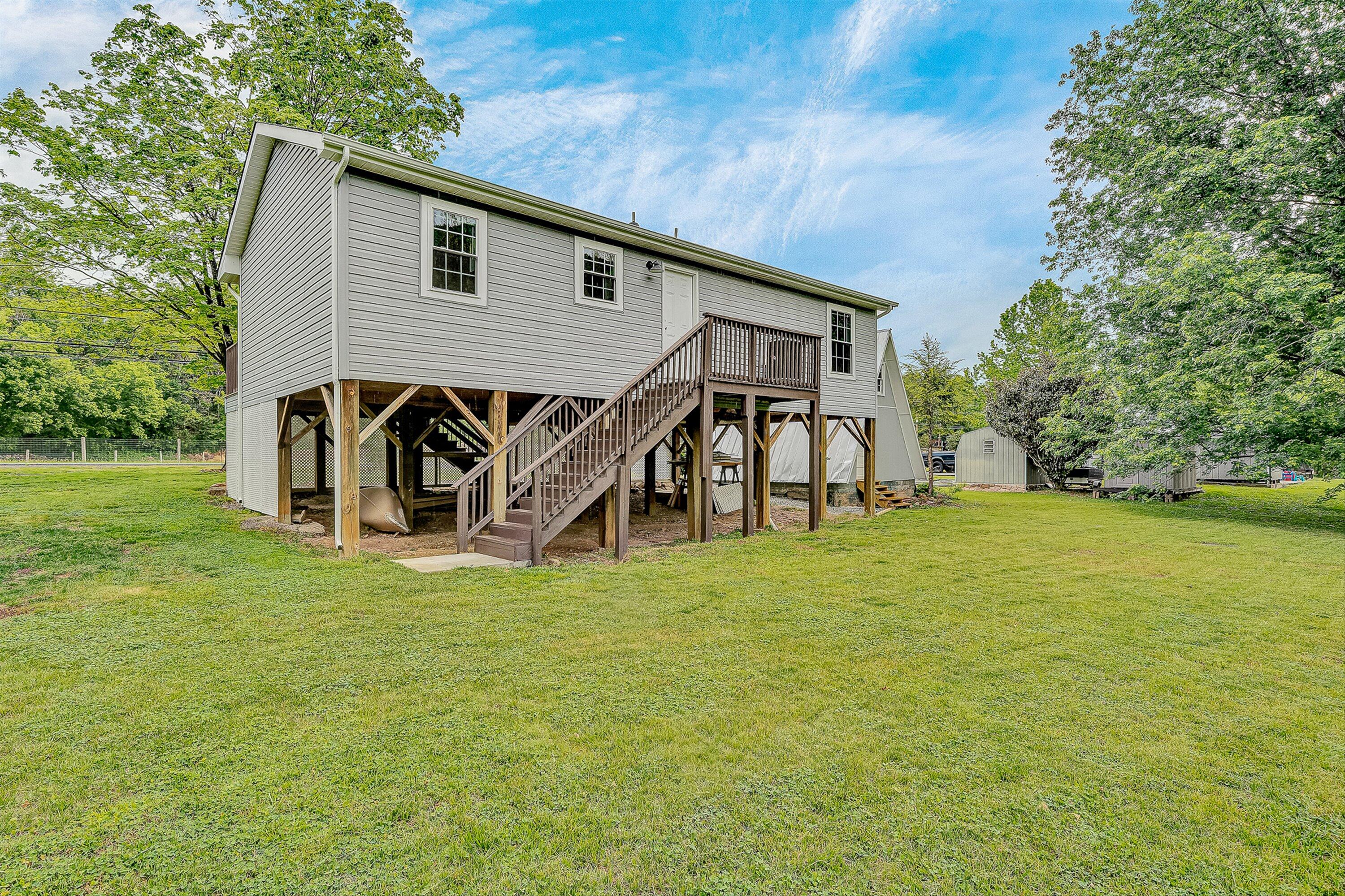 9619 Old Roanoke Road Elliston, VA 24087 - Photo 15 of 29 a view of a house with patio