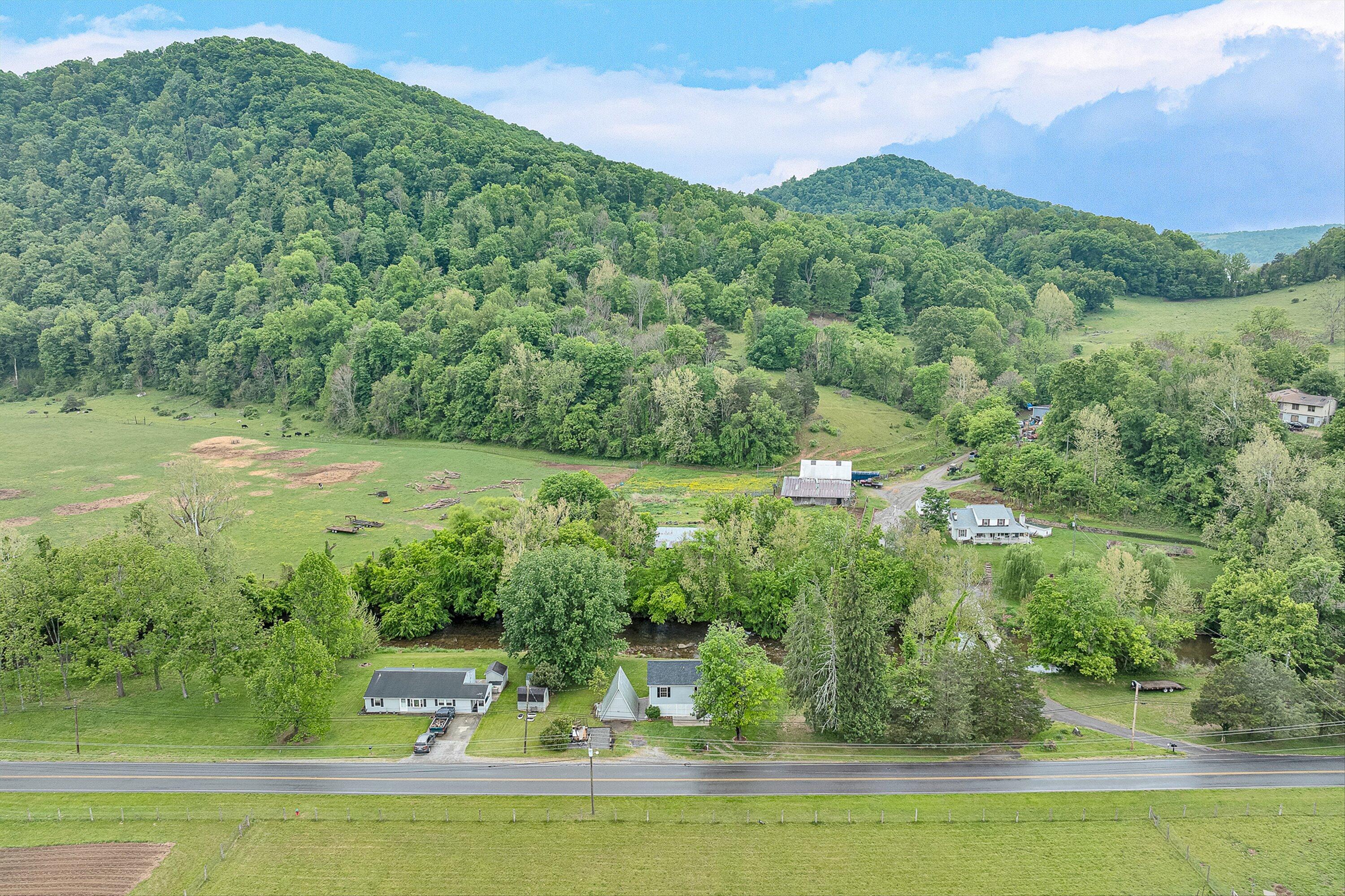 9619 Old Roanoke Road Elliston, VA 24087 - Photo 20 of 29 a view of a lake with a mountain in the back