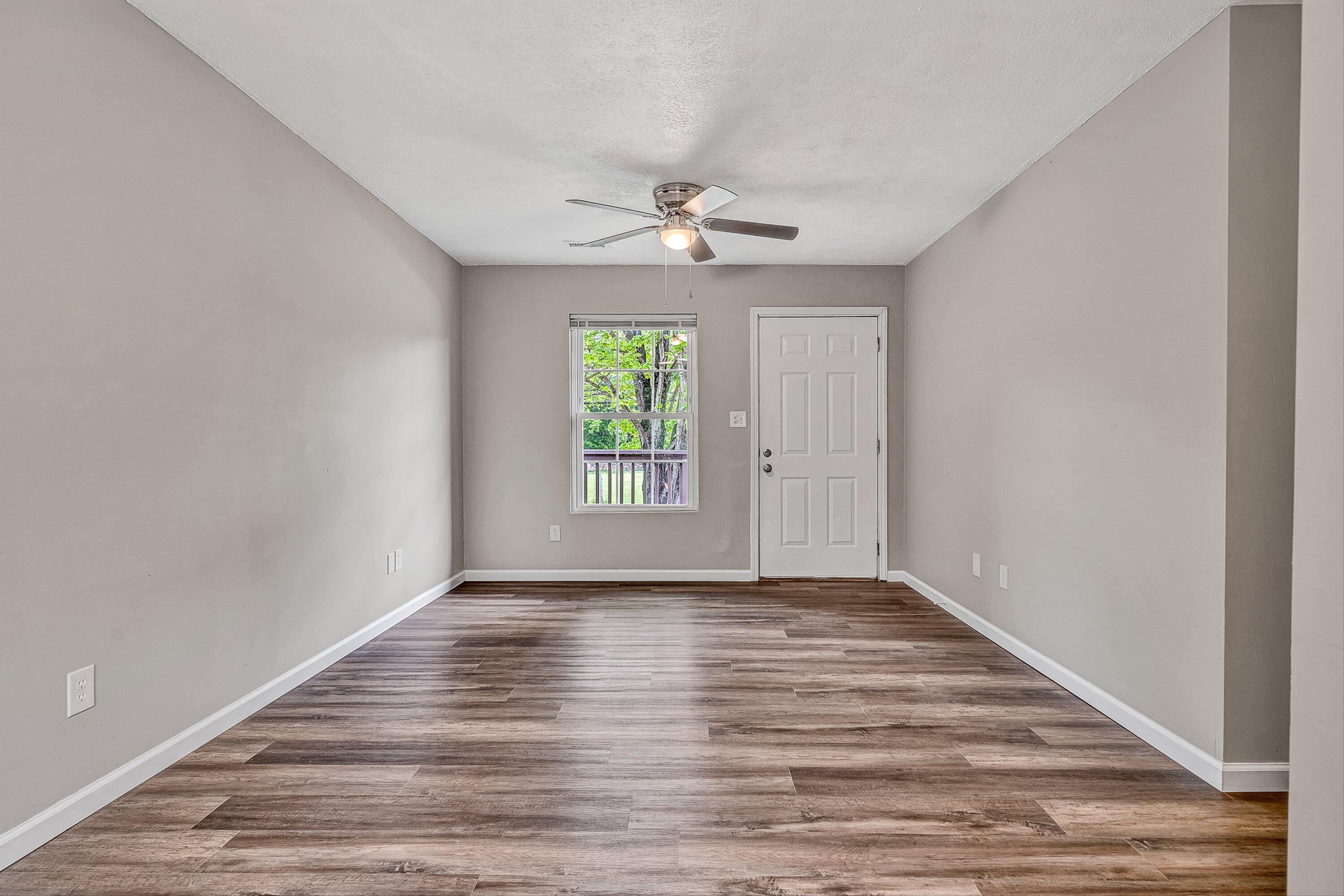 9619 Old Roanoke Road Elliston, VA 24087 - Photo 4 of 29 wooden floor in an empty room with a window