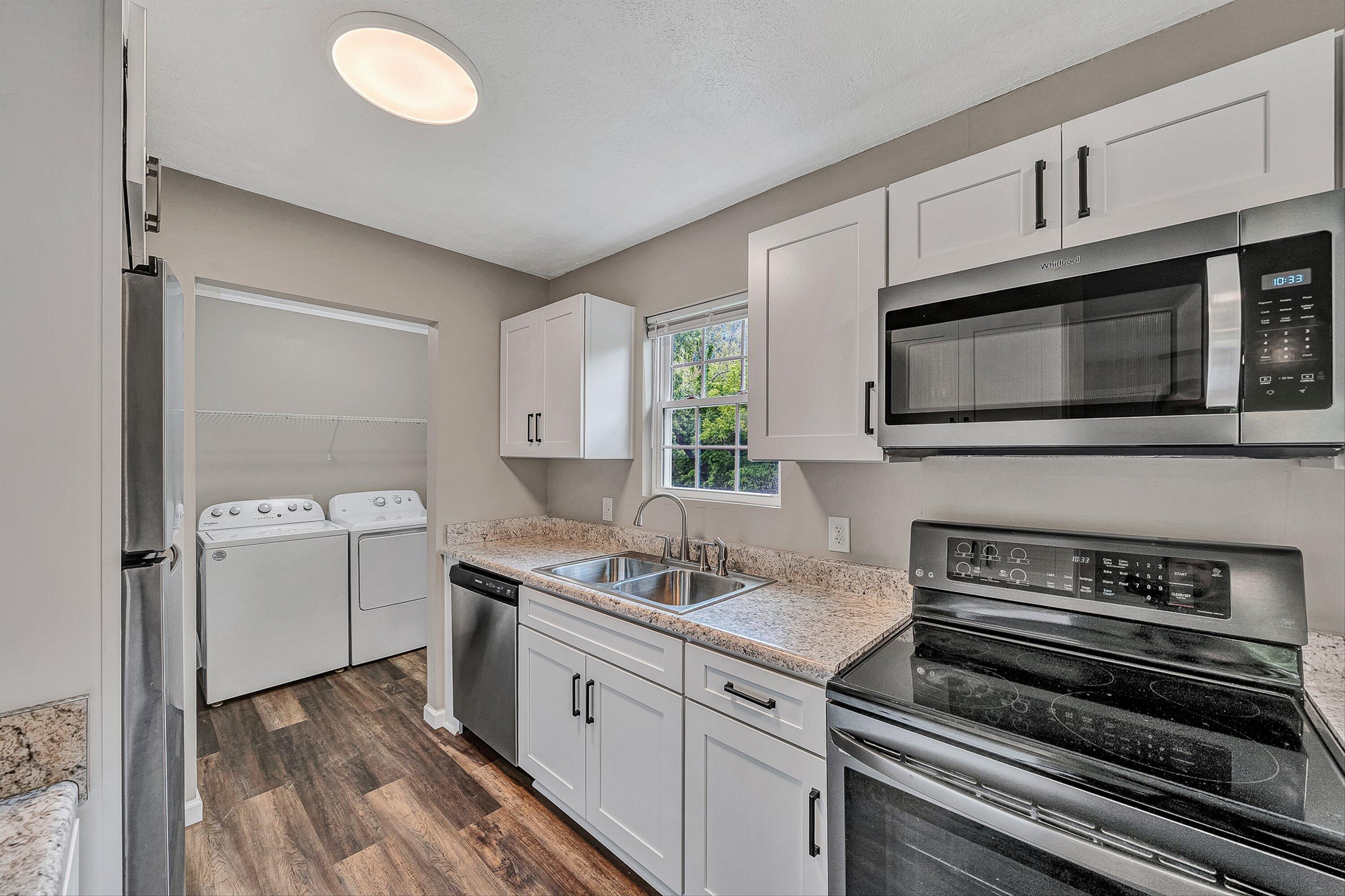 9619 Old Roanoke Road Elliston, VA 24087 - Photo 5 of 29 a kitchen with a sink stove and microwave