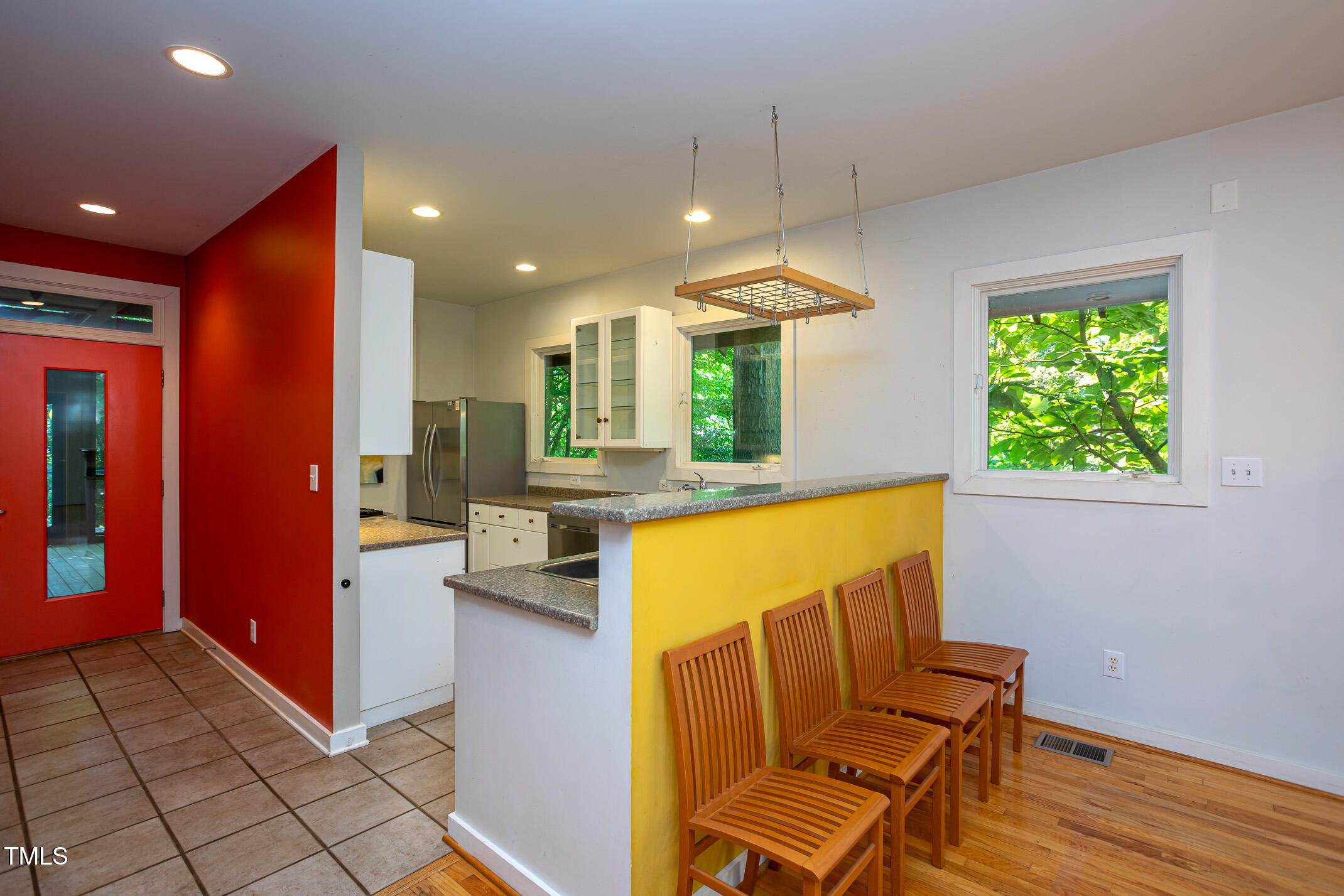 820 Runnymede Road Raleigh, NC 27607 - Photo 17 of 43 a view of kitchen with kitchen island dining table and a chandelier