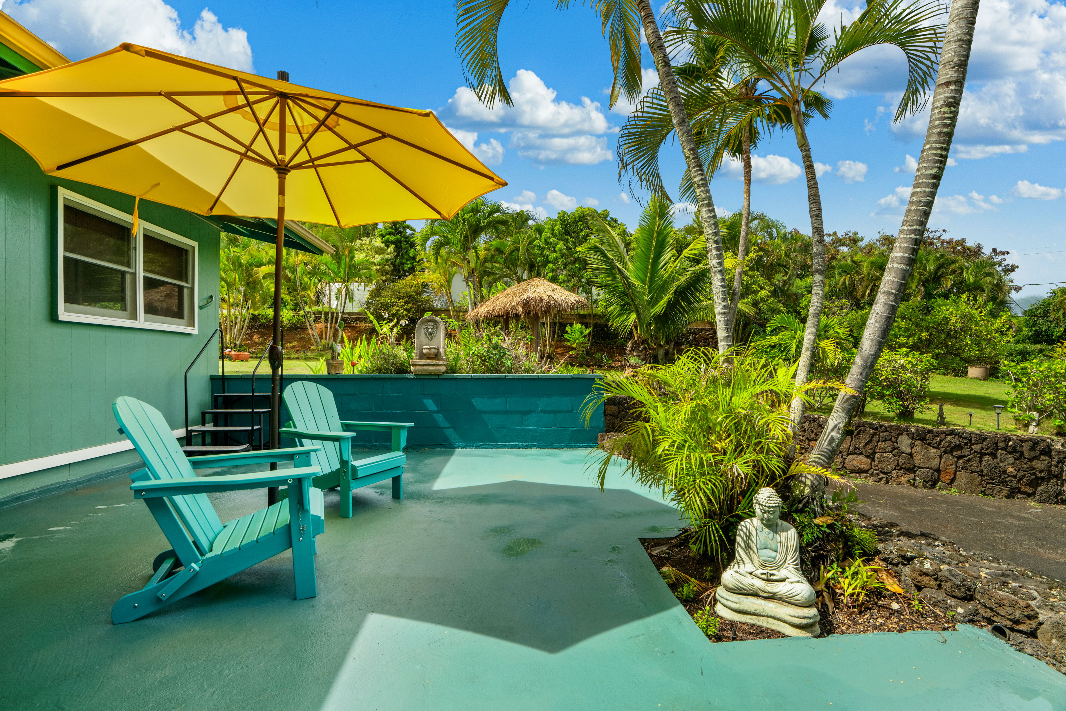 4885 Laipo Road Kapaa, HI 96746 - Photo 11 of 28 a view of a chair and table on the patio