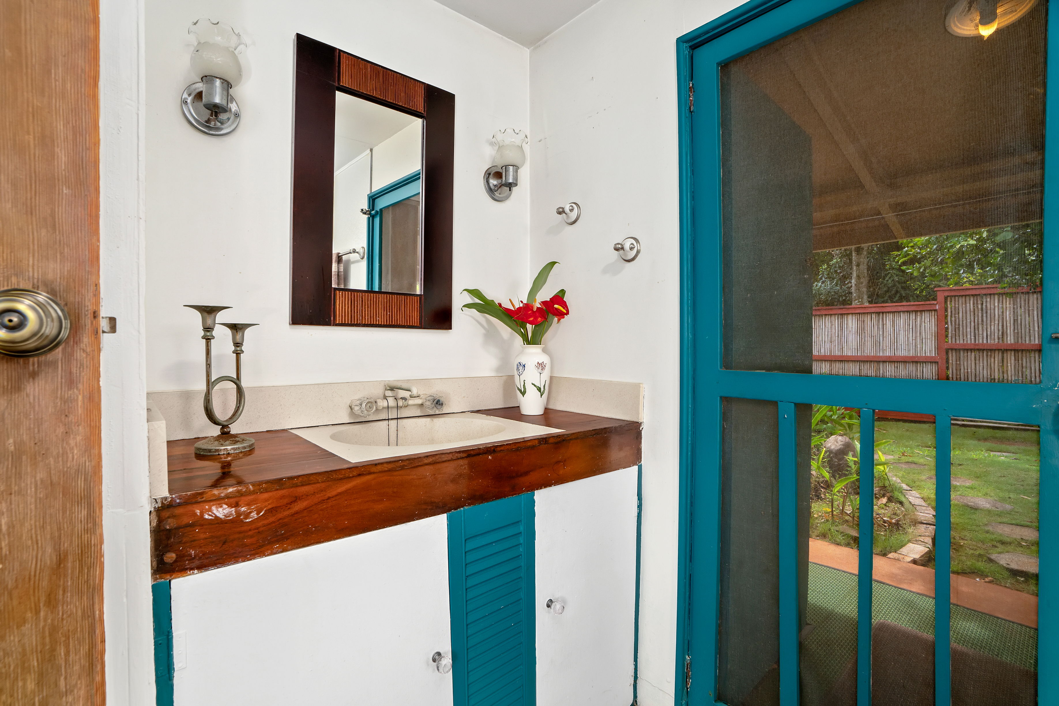 4885 Laipo Road Kapaa, HI 96746 - Photo 13 of 28 a bathroom with a sink and a mirror