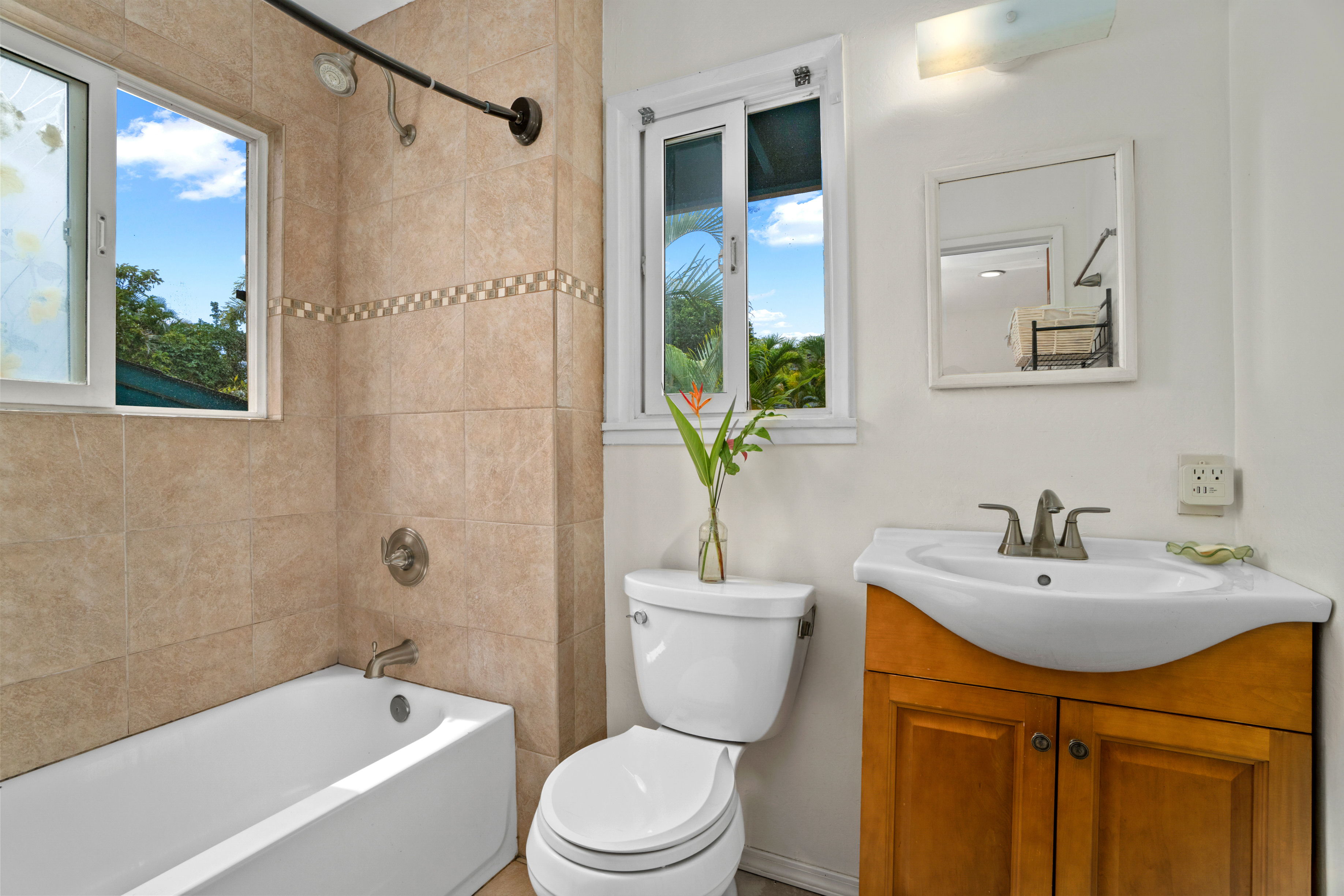 4885 Laipo Road Kapaa, HI 96746 - Photo 20 of 28 a bathroom with a sink toilet and shower