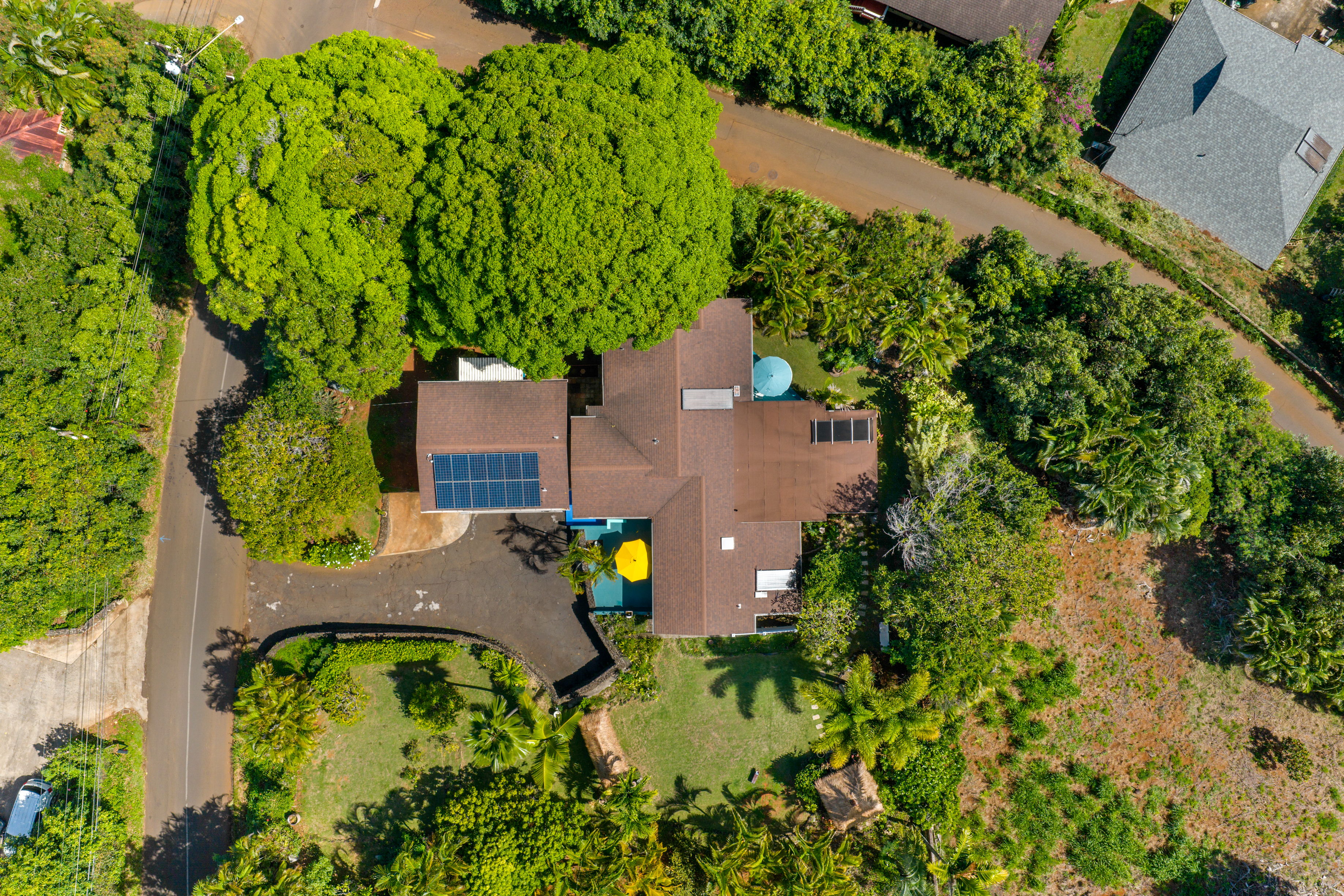 4885 Laipo Road Kapaa, HI 96746 - Photo 27 of 28 an aerial view of a house with a yard basket ball court and outdoor seating
