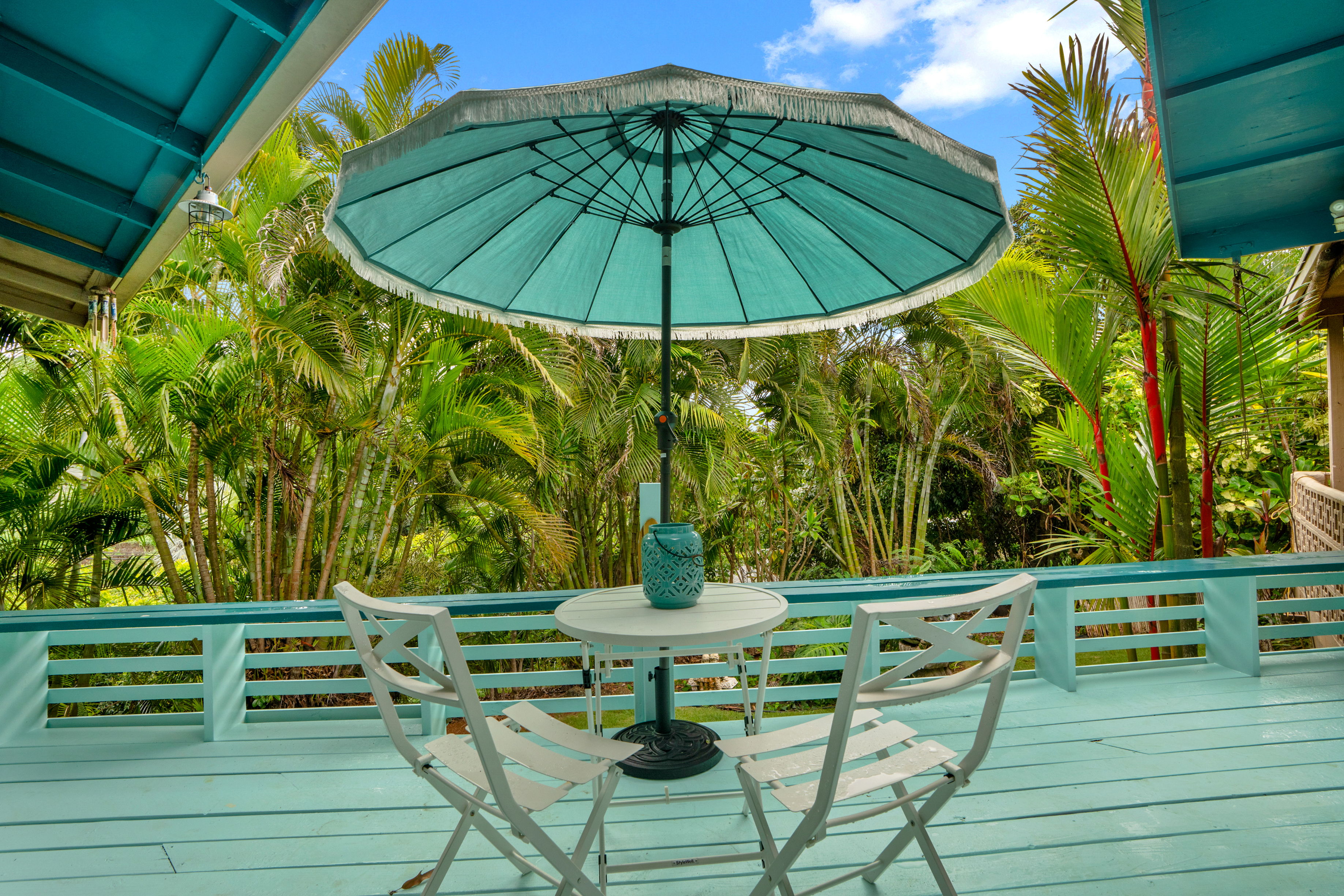 4885 Laipo Road Kapaa, HI 96746 - Photo 5 of 28 a table and chairs in a patio