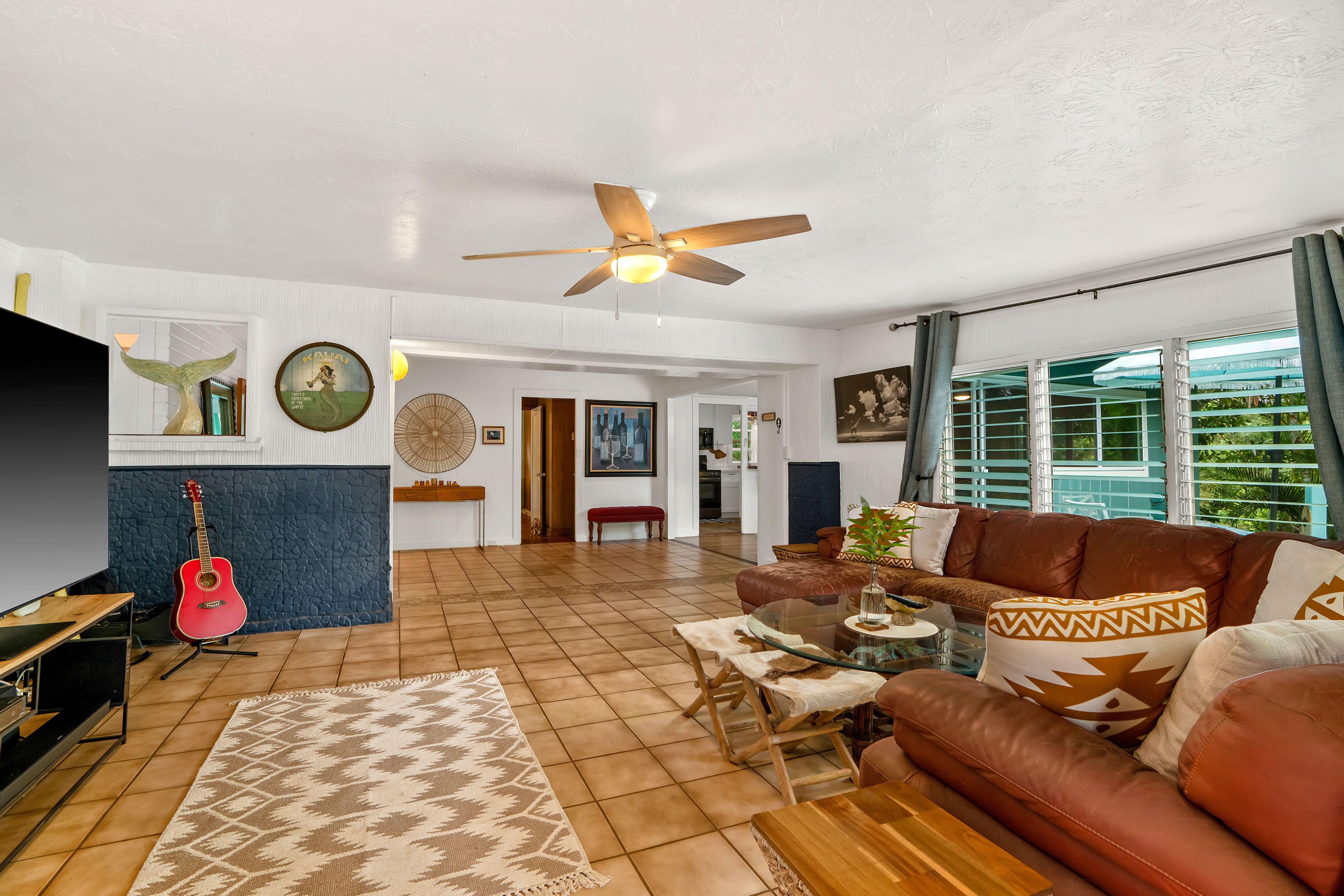4885 Laipo Road Kapaa, HI 96746 - Photo 8 of 28 a living room with furniture and a floor to ceiling window