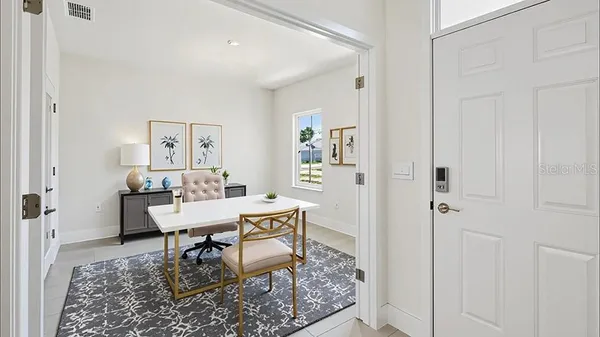 a workspace with furniture and a rug