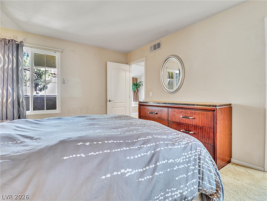 3145 East Flamingo Road, Unit 2129 Las Vegas, NV 89121 - Photo 16 of 43 A window bathes this tranquil bedroom in natural light.