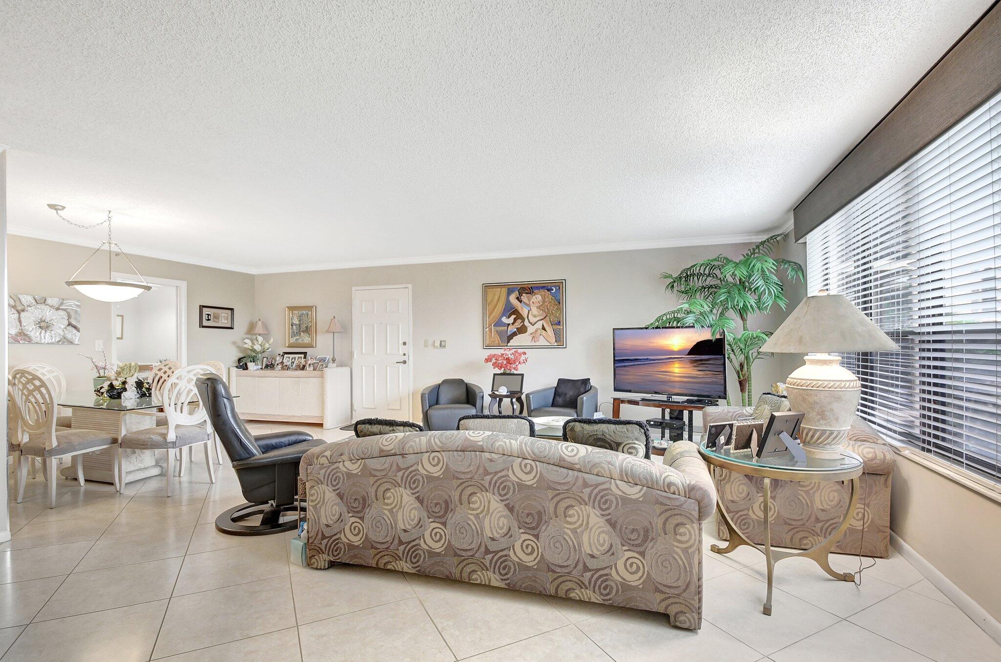 7209 Promenade Drive, Unit 302 Boca Raton, FL 33433 - Photo 3 of 36 Living room and dining room