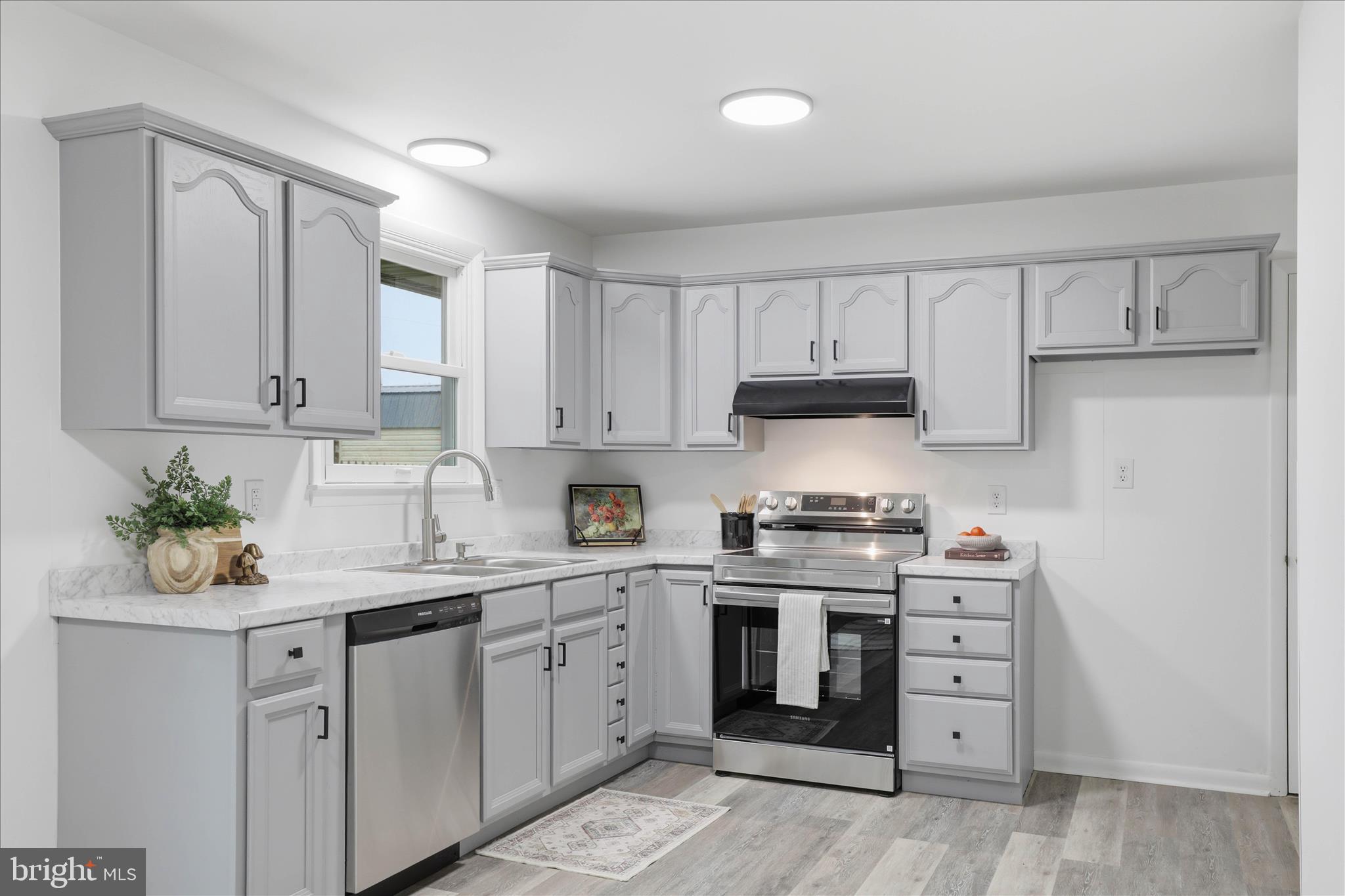 947 Hill Street Manheim, PA 17545 - Photo 13 of 47 a kitchen with stainless steel appliances granite countertop a sink and cabinets