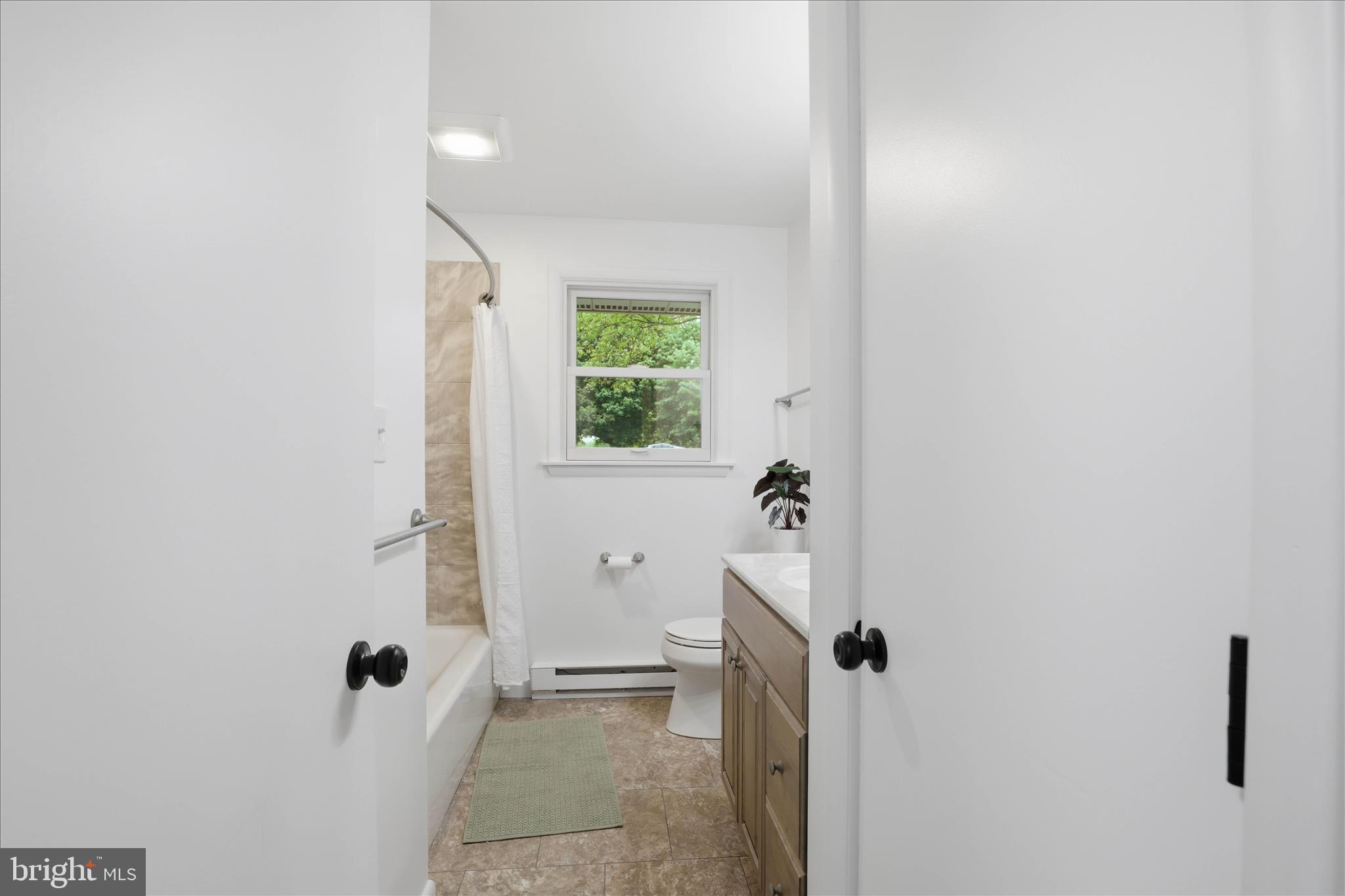 947 Hill Street Manheim, PA 17545 - Photo 19 of 47 a bathroom with a granite countertop sink and a mirror