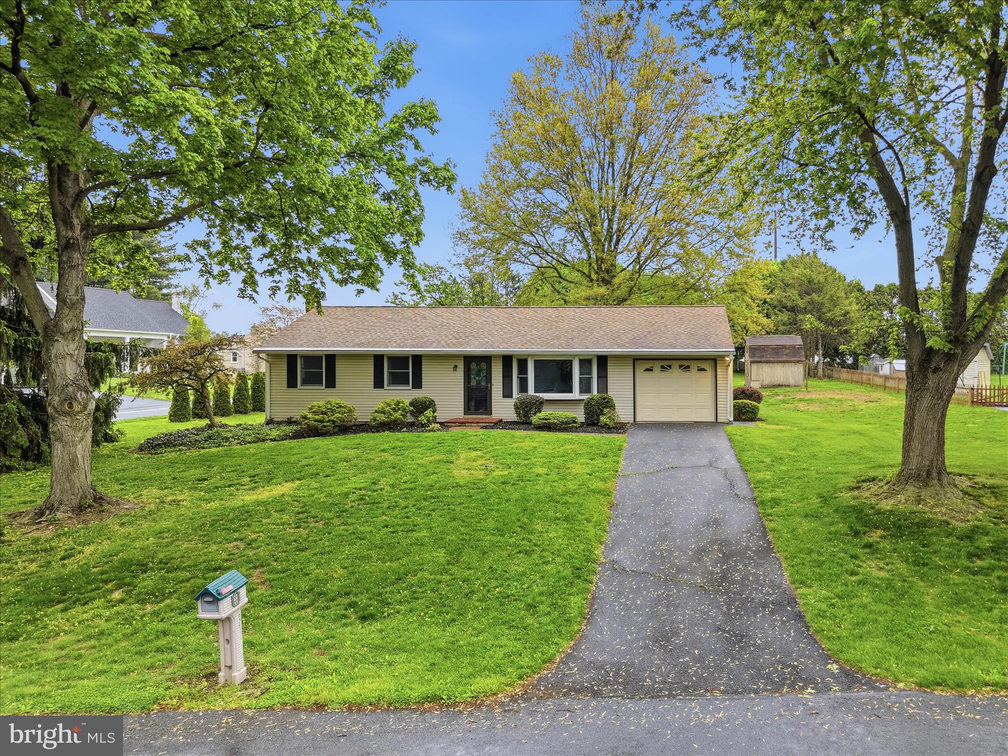 947 Hill Street Manheim, PA 17545 - Photo 2 of 47 a front view of a house with a garden