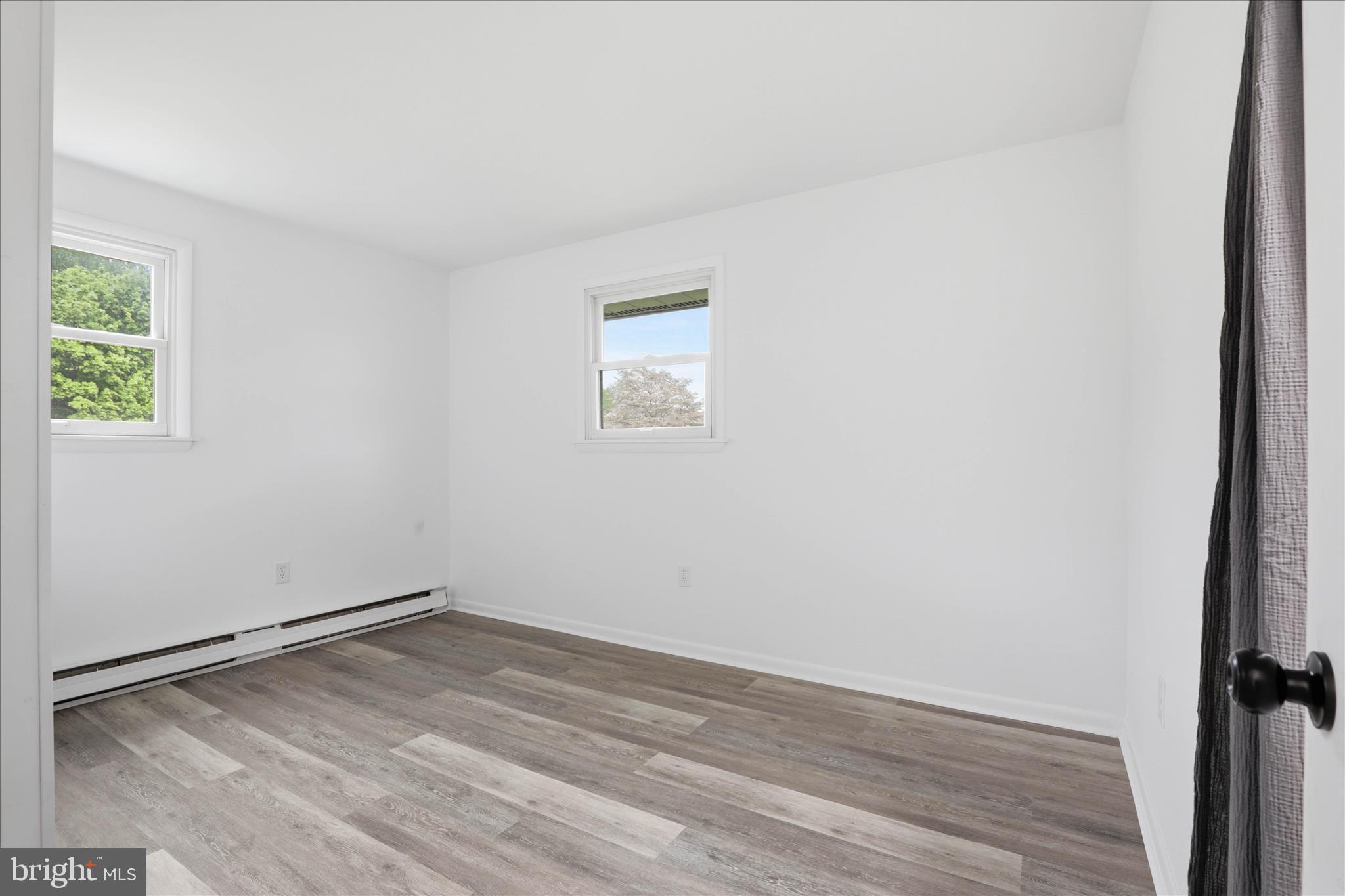 947 Hill Street Manheim, PA 17545 - Photo 23 of 47 an empty room with wooden floor and windows