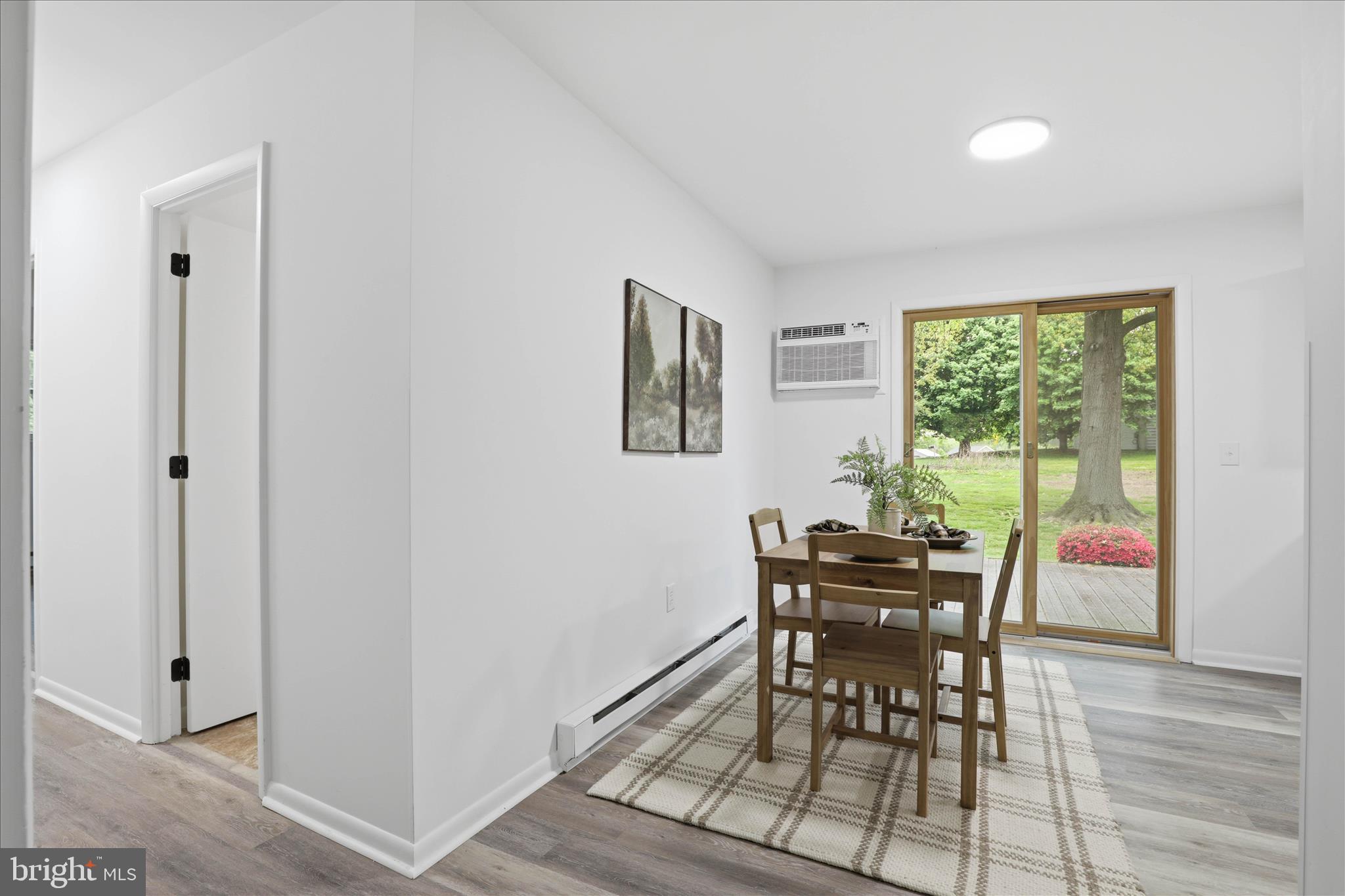 947 Hill Street Manheim, PA 17545 - Photo 8 of 47 a view of a dining room with furniture window and wooden floor