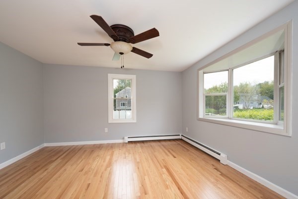 9 Autumn Way Pembroke, MA 02359 - Photo 11 of 42 a view of an empty room with wooden floor and a window