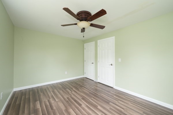 9 Autumn Way Pembroke, MA 02359 - Photo 18 of 42 a view of wooden floor and a chandelier fan in a room