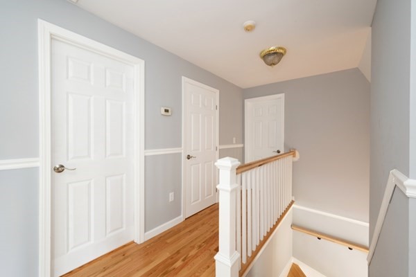 9 Autumn Way Pembroke, MA 02359 - Photo 19 of 42 a view of a hallway with wooden floor and entryway
