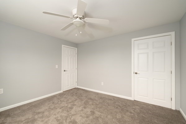 9 Autumn Way Pembroke, MA 02359 - Photo 24 of 42 an empty room with windows and fan
