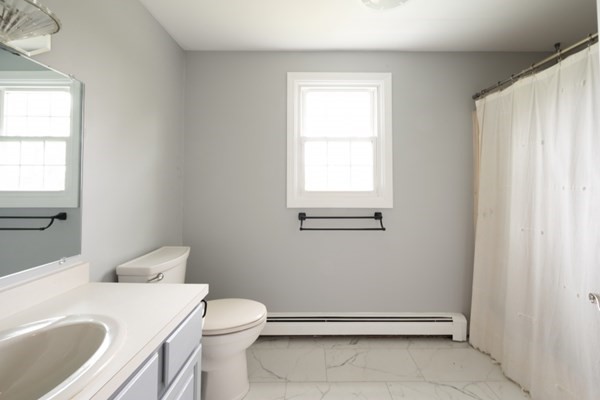 9 Autumn Way Pembroke, MA 02359 - Photo 25 of 42 a bathroom with a sink a toilet and window