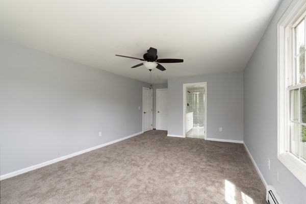 9 Autumn Way Pembroke, MA 02359 - Photo 26 of 42 a view of empty room with wooden floor and fan