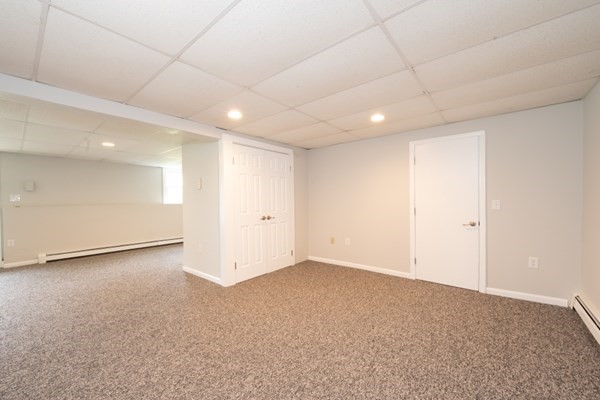 9 Autumn Way Pembroke, MA 02359 - Photo 32 of 42 an empty room with a empty space and windows