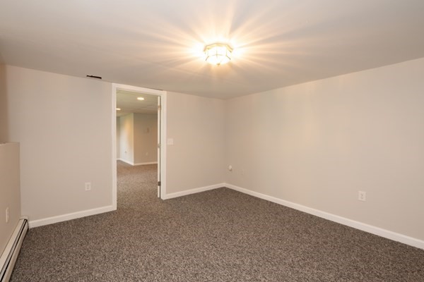 9 Autumn Way Pembroke, MA 02359 - Photo 35 of 42 an empty room with a ceiling fan and bathroom