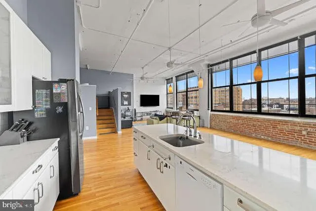 a large kitchen with a large window