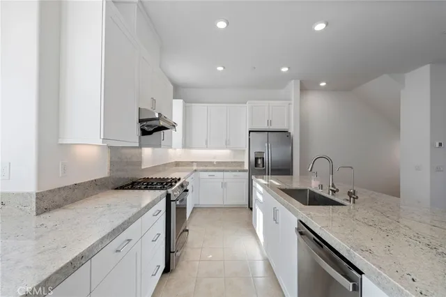 a view of a kitchen sink and a window