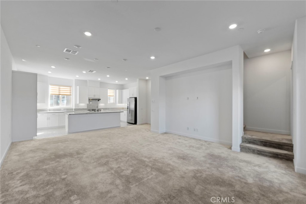 398 Merit Irvine, CA 92618 - Photo 19 of 55 a view of an empty room with kitchen and window
