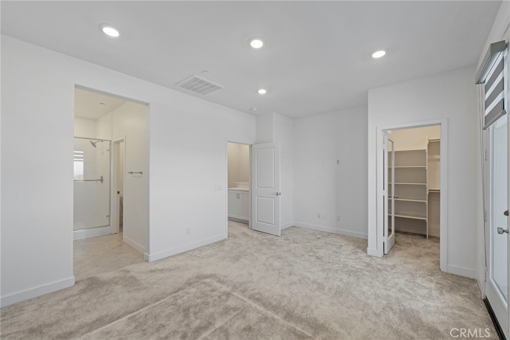 398 Merit Irvine, CA 92618 - Photo 24 of 55 an empty room with closet and a bathroom