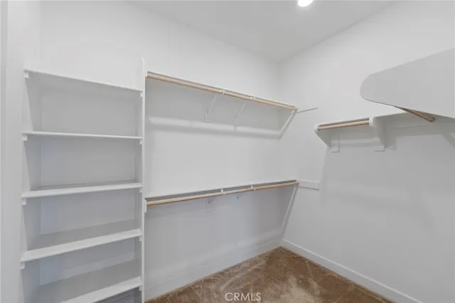 a bathroom with a shower sink and mirror