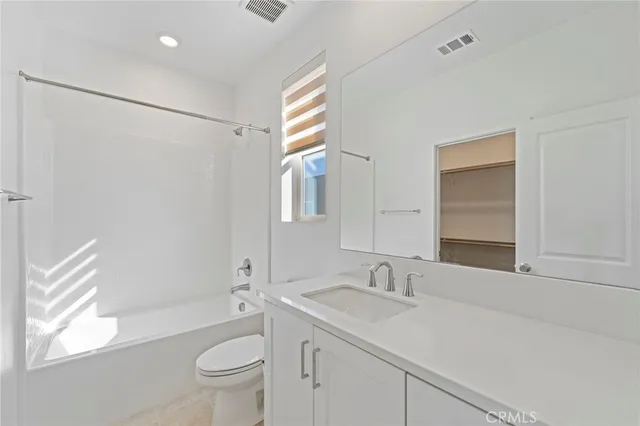 a view of entrance gate of house and car parked